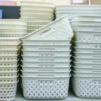 Plastic baskets on the shelf in the store
